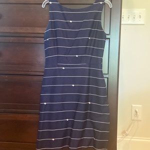 Navy/ cream dress with full skirt. Square neckline in back with zipper. Size 4.